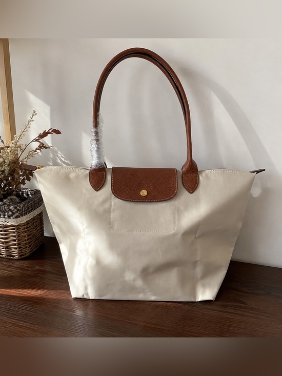 Longchamp Handbags - Longchamp Cream Tote with Brown Leather Trim